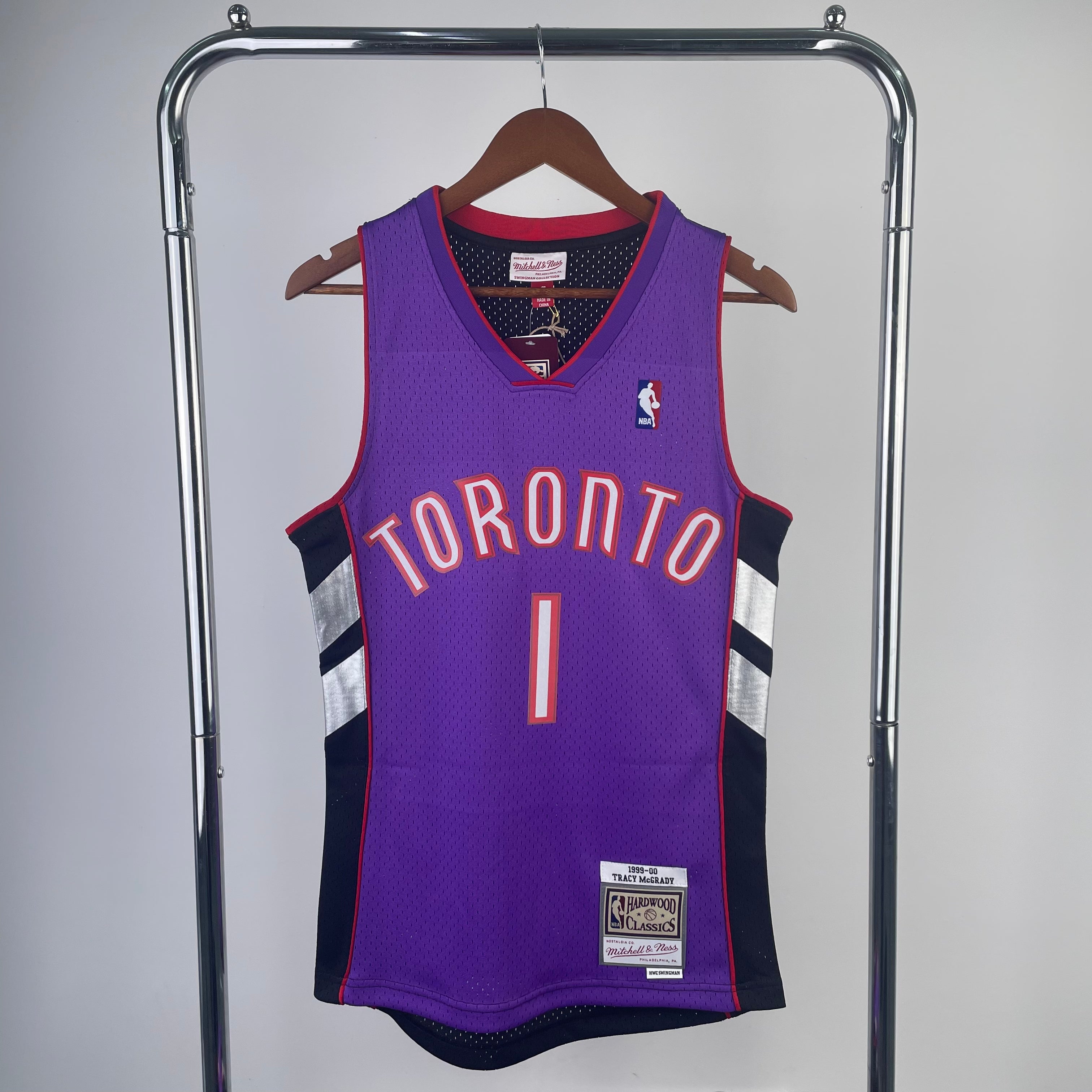 Camisa masculina Toronto Raptors Tracy McGrady Mitchell & Ness roxa 1999/00 Hardwood Classics Swingman