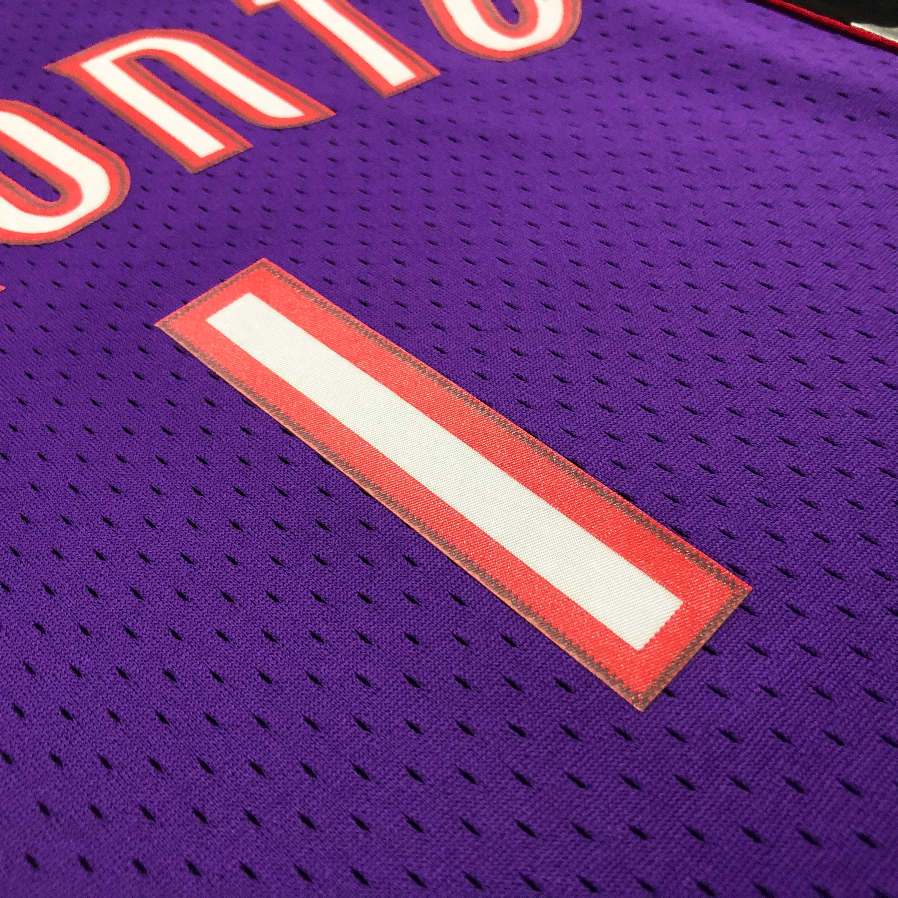 Camisa masculina Toronto Raptors Tracy McGrady Mitchell & Ness roxa 1999/00 Hardwood Classics Swingman